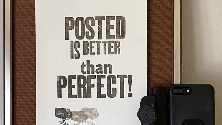 An image of a framed poster saying posted is better than perfect
